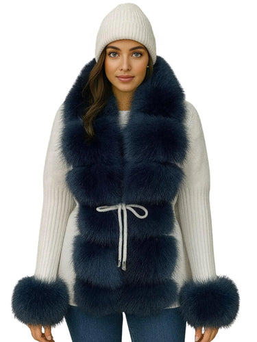 Woman wearing a blue fur sweater coat with a white background